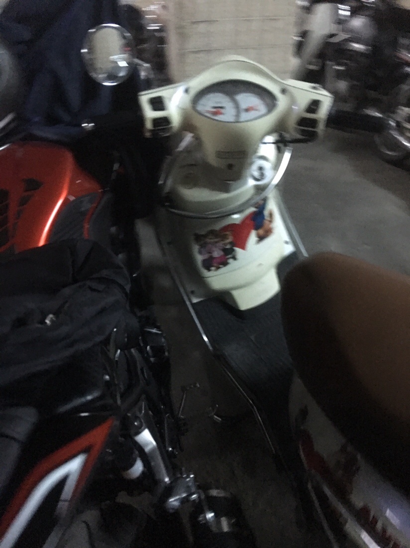Scooter lose to.y motorcycle in Saigon 