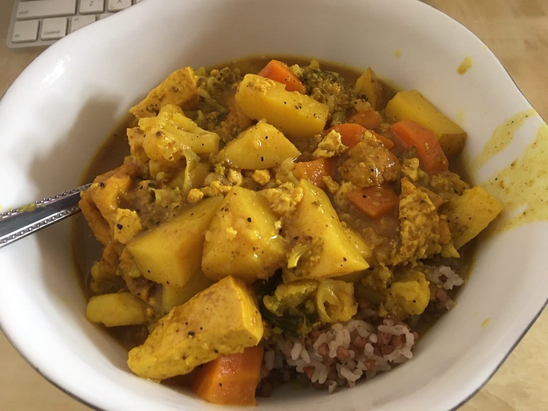 Homemade vegetarian Japanese curry with a sticky rice and barley mixture