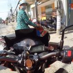 Ninja motorbike rider in Saigon
